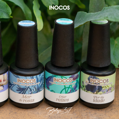 Três frascos de verniz gel INOCOS com rótulos coloridos e nomes em português
