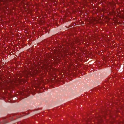 Close-up de verniz vermelho brilhante com glitter