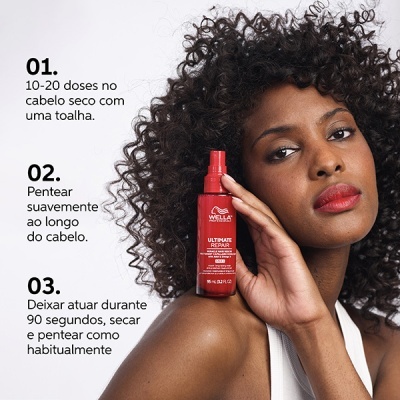 Mulher segurando frasco vermelho de spray Wella Ultimate Repair com instruções em português ao lado.
