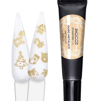 Tubo preto de gel carimbo INOCOS e unhas artificiais brancas com padrões dourados natalícios