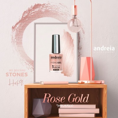 Frasco de verniz gel híbrido andreia Rose Gold com decoração e livros numa estante de madeira