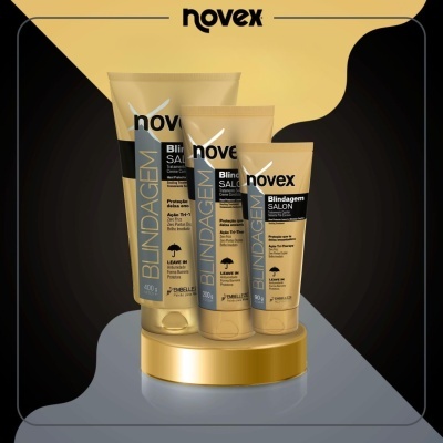 Três tubos amarelos Novex Blindagem SALON com detalhes pretos sobre base dourada