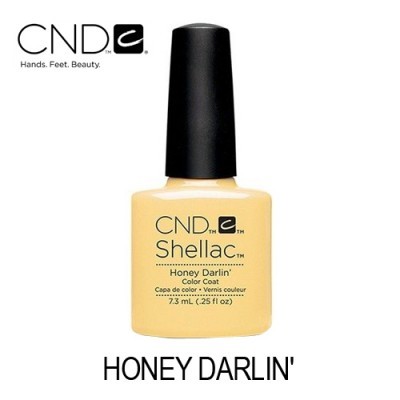 Verniz para unhas CND Shellac Honey Darlin' amarelo claro com tampa preta.