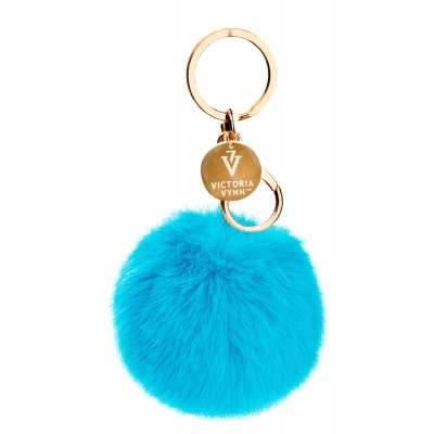 Chaveiro com pompom azul turquesa e placa metálica dourada Victoria Vynn