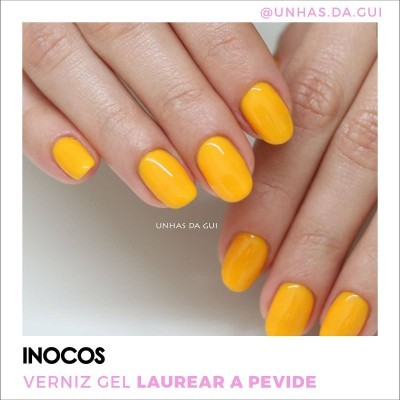 Unhas pintadas de verniz gel amarelo brilhante