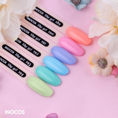 Amostras de verniz gel INOCOS em tons pastel numeradas 189 a 194 sobre fundo rosa com flores