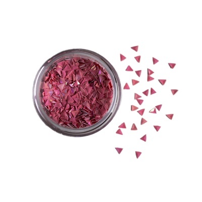 Frasco com pedaços triangulares cor de rosa e alguns espalhados ao lado