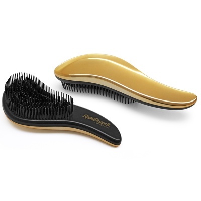 Dois penteados dourados e pretos com design ergonômico e cerdas finas.