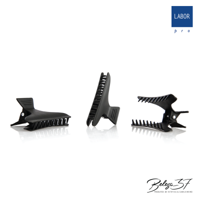 Três garras de cabelo pretas em fundo branco com o logotipo LABOR pro