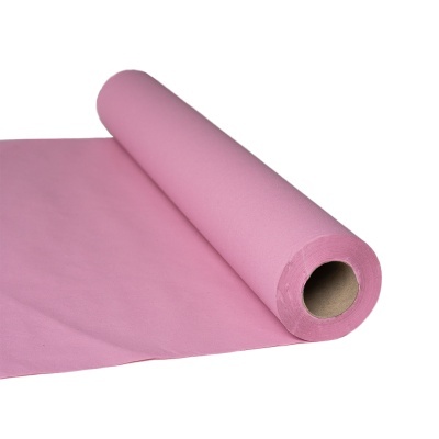 Rolo de tecido rosa claro desenrolado