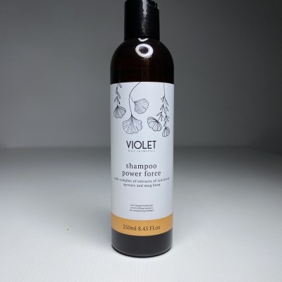 Frasco de shampoo VIOLET com rótulo branco, ilustrações de folhas e texto preto