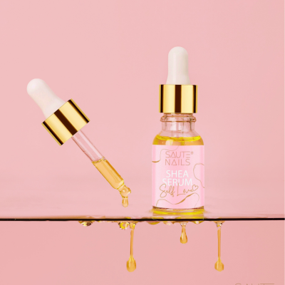 Frasco de sérum para unhas com conta-gotas e gotas de sérum suspensas