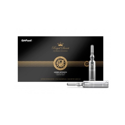 Caixa preta e dourada de ampolas para cuidado da pele com duas ampolas prateadas ao lado