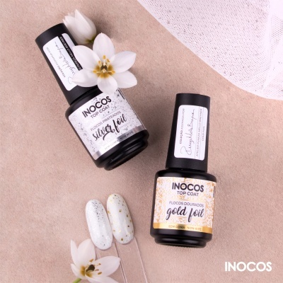 Vernizes top coat INOCOS 'silky foil' e 'gold foil' com flores brancas e amostras de unhas decoradas