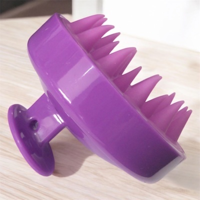 Escova de plástico roxa com ventosa e cerdas flexíveis
