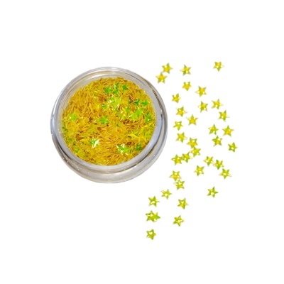 Glitter amarelo em forma de estrelas dentro e fora de um recipiente transparente