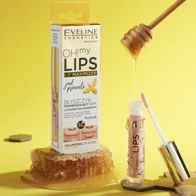 Gloss labial Eveline Cosmetics OH! my LIPS sobre favo de mel com colher de mel ao fundo
