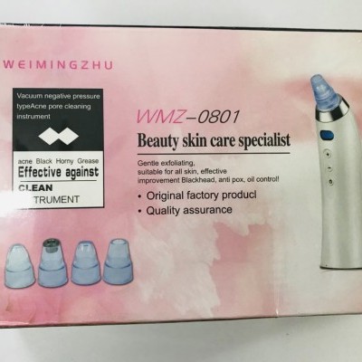 Embalagem rosa com dispositivo de limpeza de pele e cinco ponteiras transparentes azuis