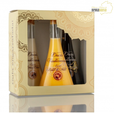 Conjunto de três garrafas de licor em caixa amarela com janela transparente