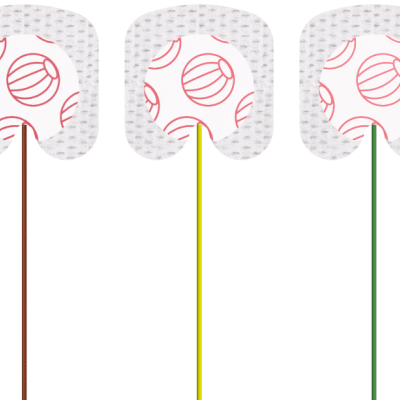 Três picks de guitarra com suportes coloridos e palhetas brancas com padrão de bolas de voleibol