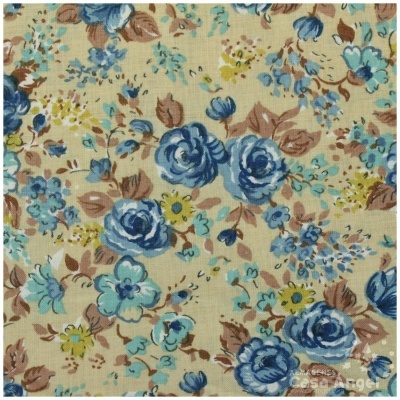 Tecido com padrão floral azul, amarelo e castanho sobre fundo bege