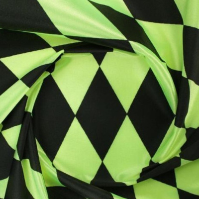 tecido com padrão geométrico de losangos preto e verde-limão