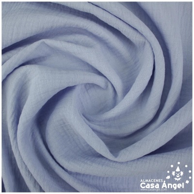 Tecido azul claro com textura suave e logótipo ALMACENES Casa Angel