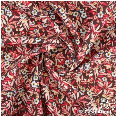 Tecido floral vermelho com flores azuis e folhas bege