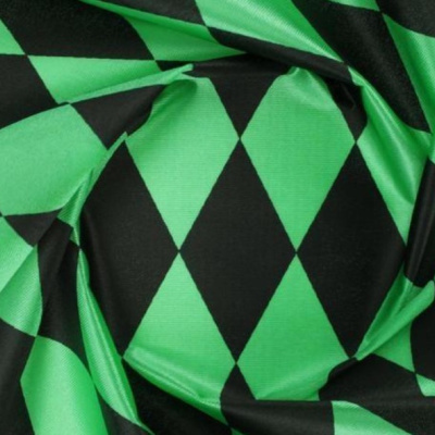 Tecido verde e preto com padrão de losangos grandes