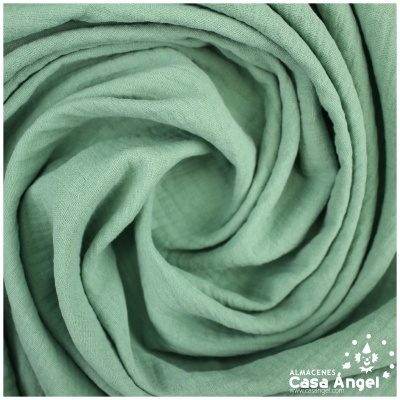 tecido verde água enrolado com textura