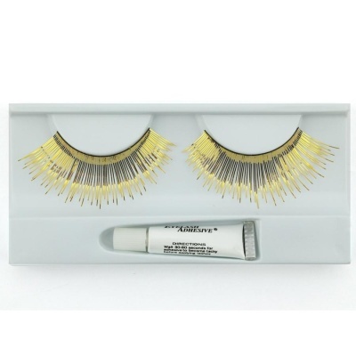 Pestanas postiças pretas e douradas com tubo de cola numa embalagem branca