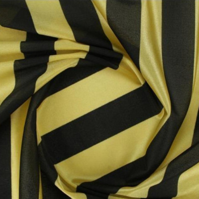 Tecido riscado em amarelo e preto com textura lisa e brilho
