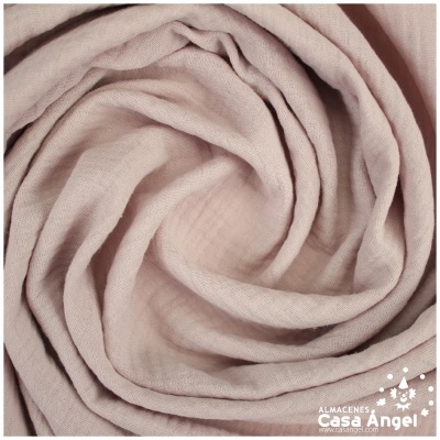 Tecido enrolado cor-de-rosa claro com textura suave
