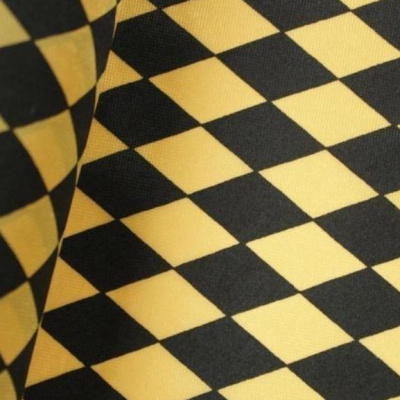 Tecido com padrão de losangos preto e amarelo