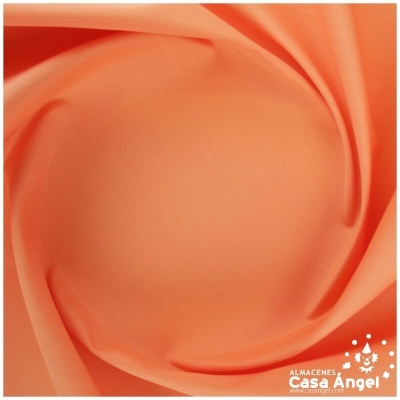 Tecido laranja suave com dobras e logotipo Casa Angel