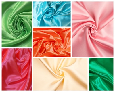 Tecidos de cetim coloridos dobrados em espiral