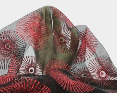 Tecido transparente com padrão circular em vermelho e preto