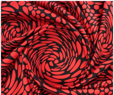 tecido vermelho e preto com padrão ondulado