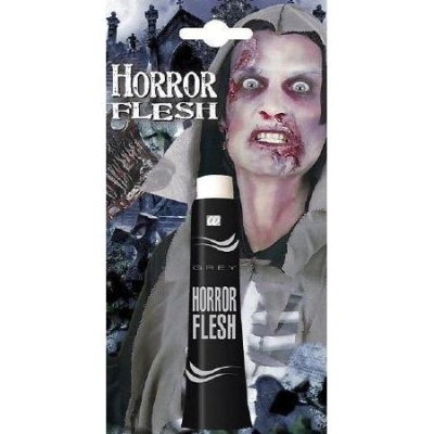 embalagem e tubo de maquilhagem HORROR FLESH com imagem de zumbi ao fundo
