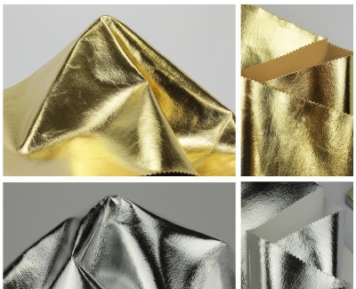 Tecidos metalizados dourado e prateado com textura brilhante