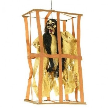 Cage suspensa com figura assustadora de macaco