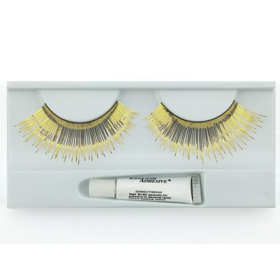 Pestanas postiças pretas e douradas com tubo de cola numa embalagem branca