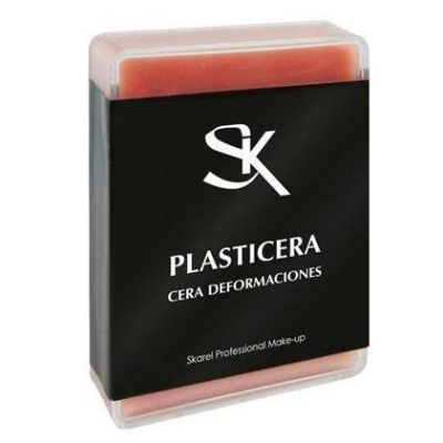 Embalagem de plástico com cera vermelha e rótulo preto com texto branco.