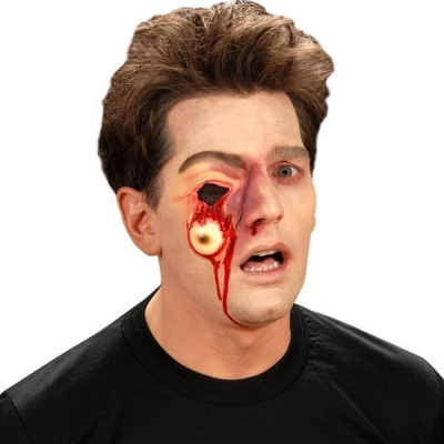 Homem com maquilhagem especial de Halloween com efeito olho caído e hemorragia.