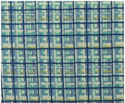 Tecido com padrão geométrico em tons de azul, verde, cinza e amarelo