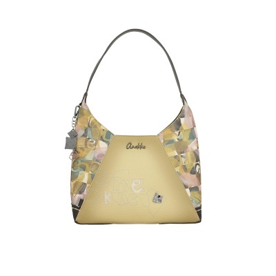 Mala de ombro Anekke com corpo amarelo e laterais estampadas em fundo branco