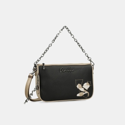 Mala de mão preta e bege com alça de corrente e detalhes geométricos