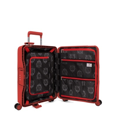 Mala de viagem vermelha aberta com interior preto padrão