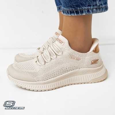 Ténis Skechers Slip-Ins bege com sola de borracha e detalhes cor de bronze