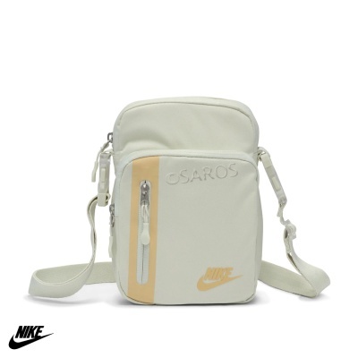 Bolsa pequena de ombro Nike creme com bolso frontal e logótipo laranja.